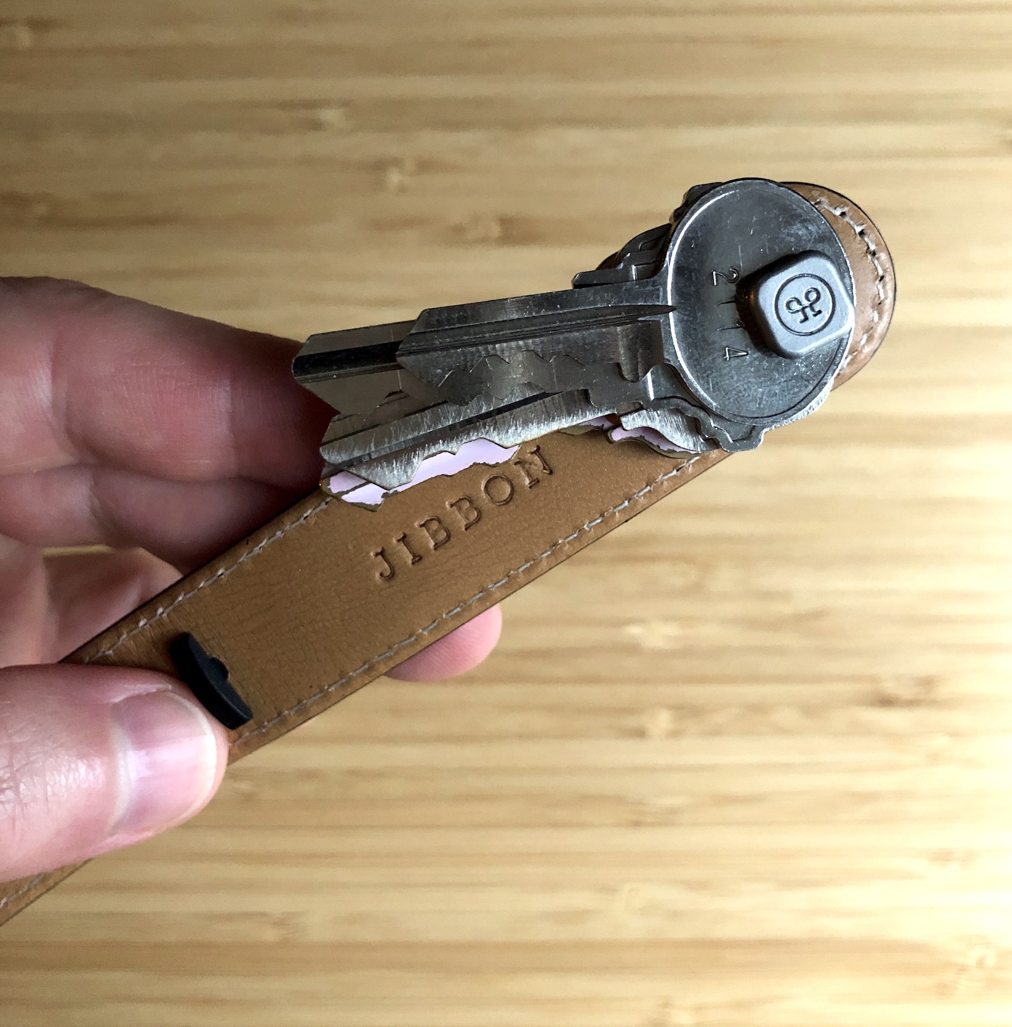 Short demonstration on how to open the key ring on the key pouch